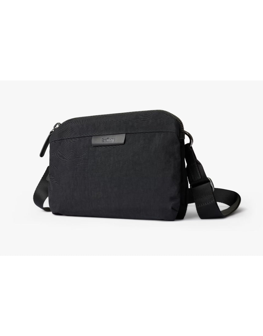 Bellroy Tokyo Side Bag in Raven, a sleek black crossbody bag with adjustable strap and minimalist design, suitable for daily use.