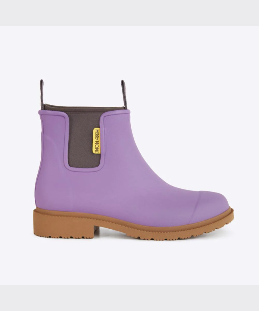 Merry People Bobbi Gumboots in dusty lilac color, side view showing waterproof rubber material and stylish ankle height.