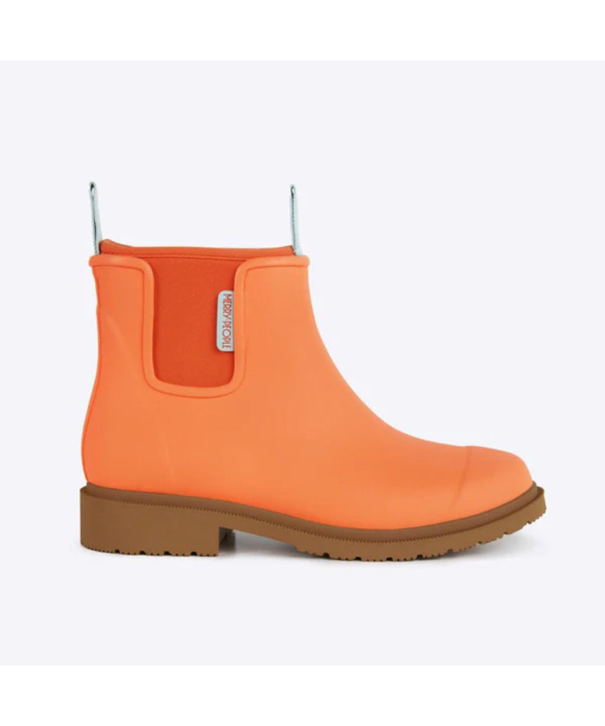Orange Merry People Bobbi gumboots with Sherbet hue, shown from the side, durable waterproof footwear for rainy weather.