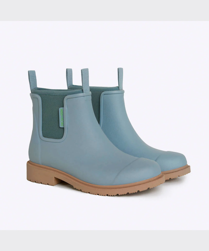 Seafoam Merry People Bobbi gumboots with black soles, stylish waterproof rubber footwear for rainy days.