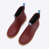 Brick red Merry People Bobbi gumboots shown from a high angle, featuring waterproof design and stylish rubber footwear for rainy days.