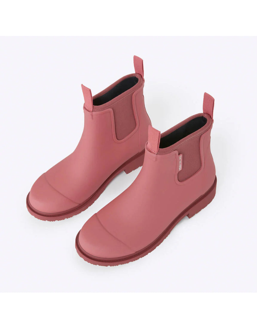 Merry People Bobbi gumboots in clay, waterproof rubber rain boots with a high-angle view and textured sole.