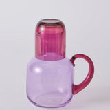 Kip & Co lilac fiesta carafe with matching glass set, elegant glassware for serving drinks in a stylish home.