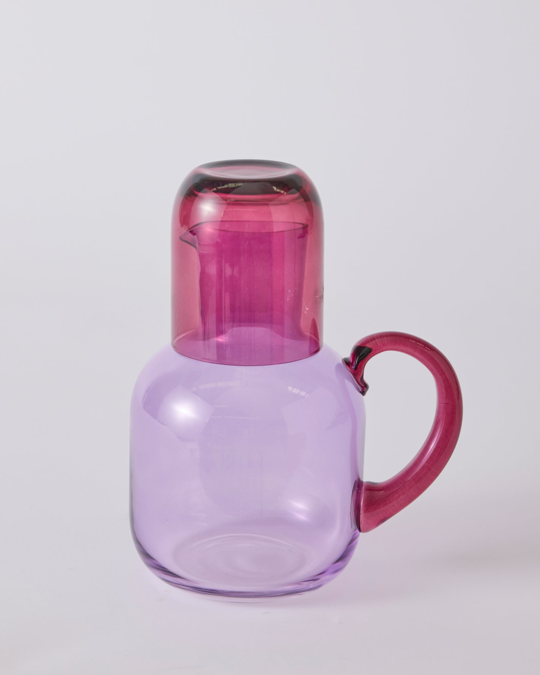 Kip & Co lilac fiesta carafe with matching glass set, elegant glassware for serving drinks in a stylish home.