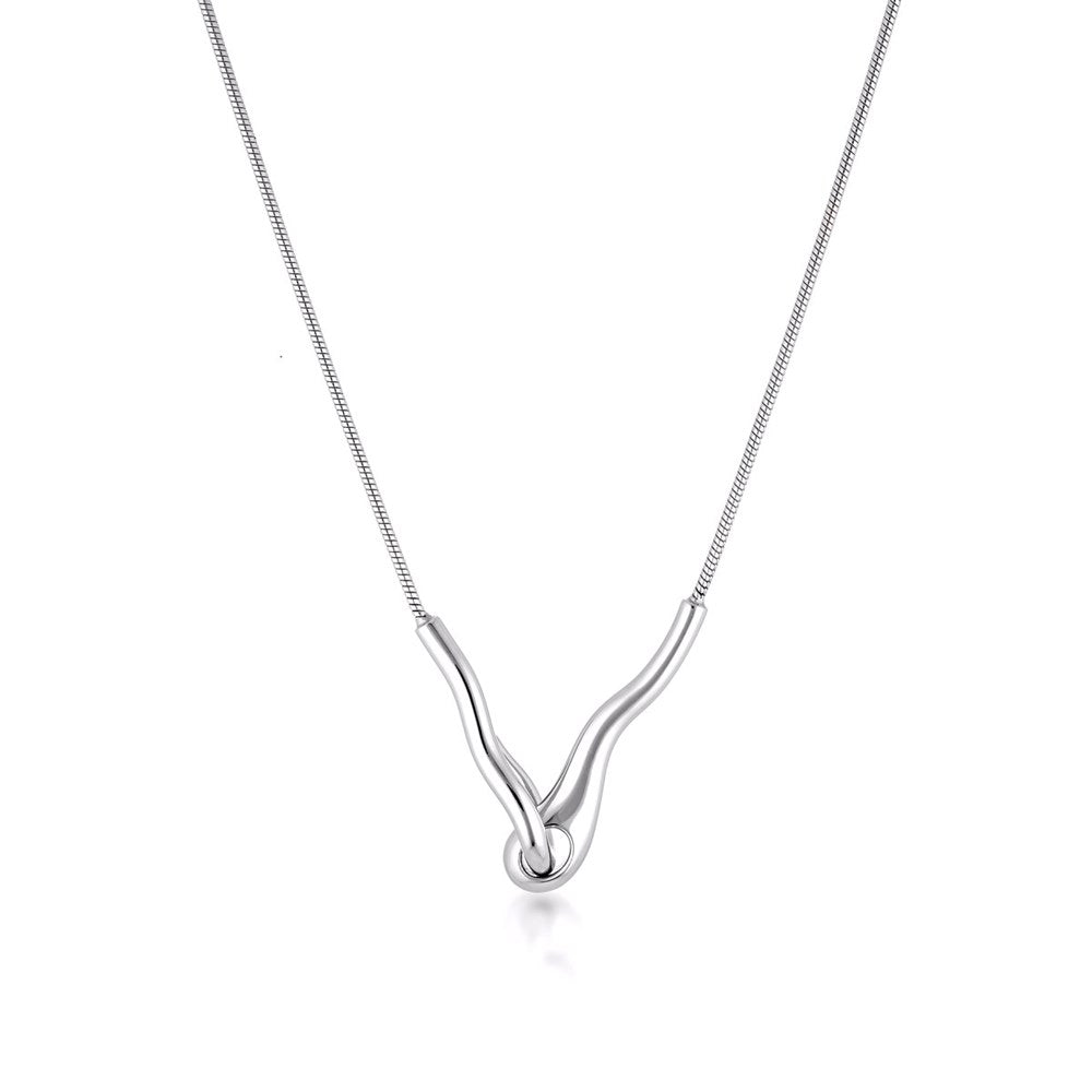 Linda Tahija Ripple Necklace featuring a sleek, modern silver design with smooth, flowing curves on a delicate chain.