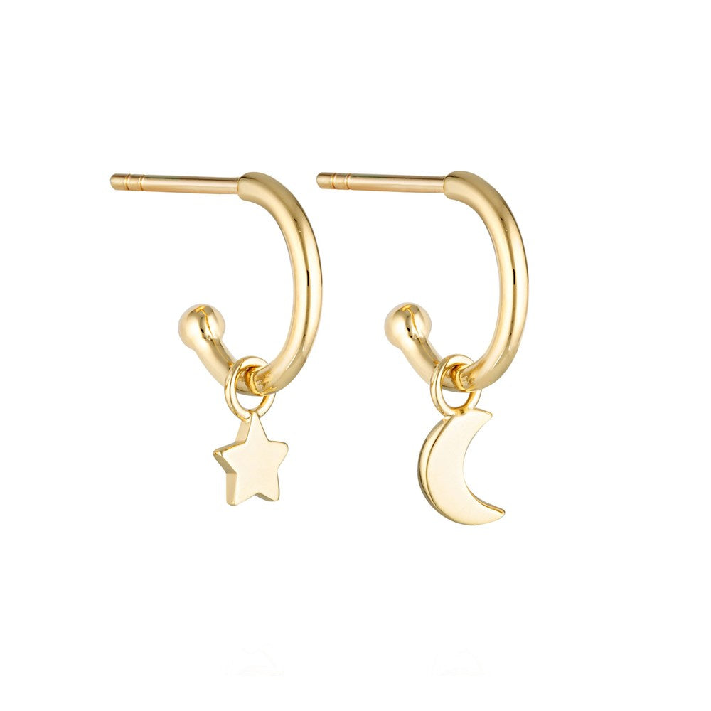 Linda Tahija star and moon charm earrings featuring gold-tone celestial pendants on delicate hooks.