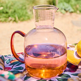 Kip & Co marshmallow and marmalade glass carafe with matching glass, featuring colorful, playful patterns on clear glass.
