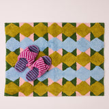Kip & Co Genie bath mat with colorful, soft fabric and playful design, perfect for adding style and comfort to your bathroom.