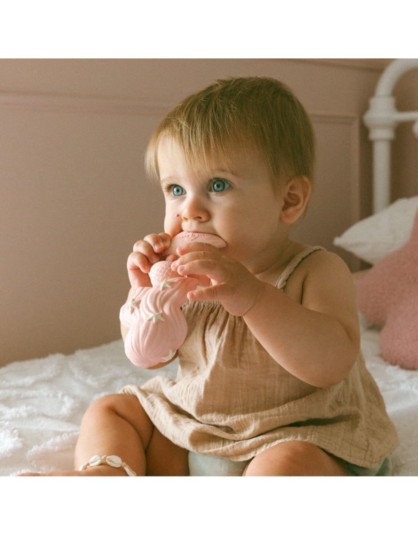 Winnie Parkes Maeve the Mermaid rubber teether in peach, soft and textured for soothing babies, with detailed mermaid design.