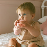 Winnie Parkes Maeve the Mermaid rubber teether in peach, soft and textured for soothing babies, with detailed mermaid design.