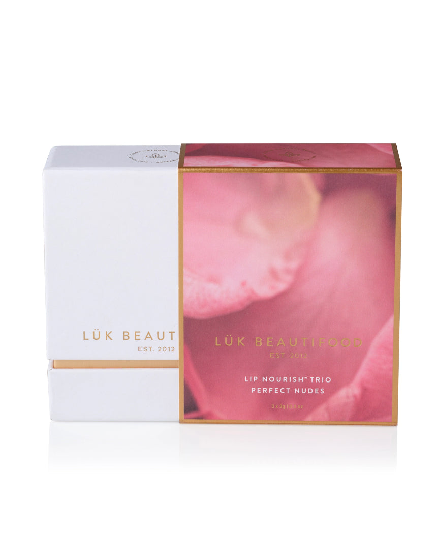 Lük Beautifood Lip Nourish Trio with three nude-colored lip balms in a natural, eco-friendly packaging.