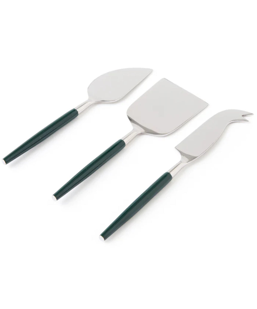 Kip & Co Eden Diner cheese knife set with four stainless steel knives and decorative handles on a wooden cheese board.