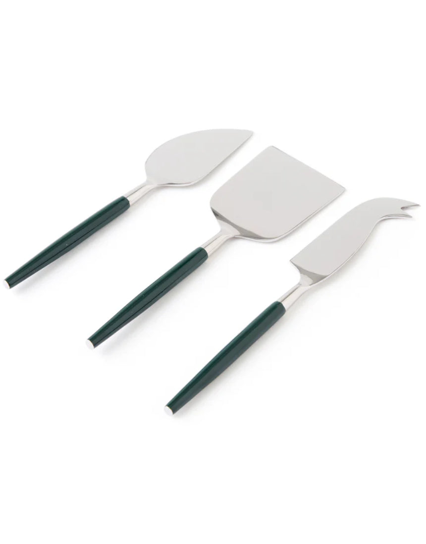 Kip & Co Eden Diner cheese knife set with four stainless steel knives and decorative handles on a wooden cheese board.