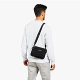 Bellroy Tokyo Side Bag in Raven, a sleek black crossbody bag with adjustable strap and multiple compartments for everyday essentials.