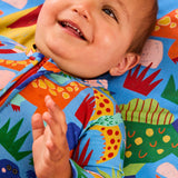 Kip & Co Dinosaur Roar organic long sleeve baby romper with zipper, featuring colorful dinosaur print and cozy fabric for infants.