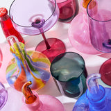 Kip & Co Lilac Fiesta carafe with matching glass, vibrant purple glassware set for serving beverages in a stylish kitchen.