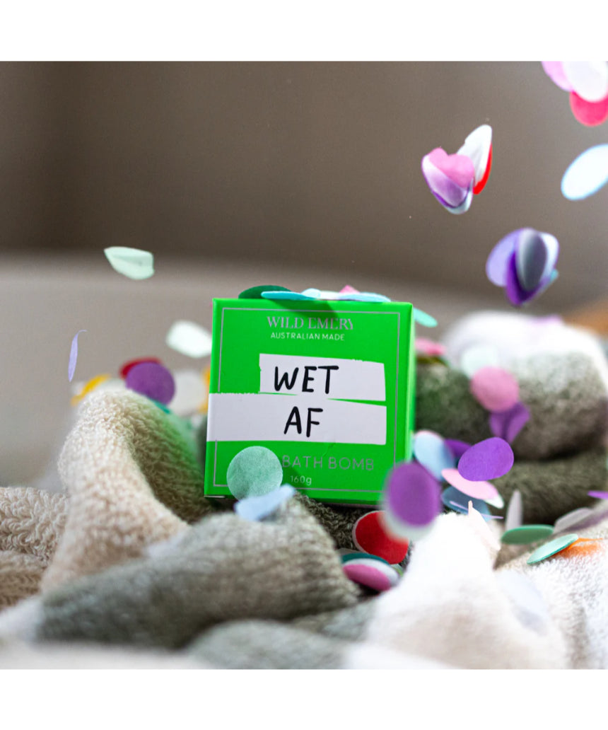 Wild Emery Wet AF Bath Bomb in vibrant colors, showing a round, fizzing bath bomb with a bold, playful design for bath & body use.