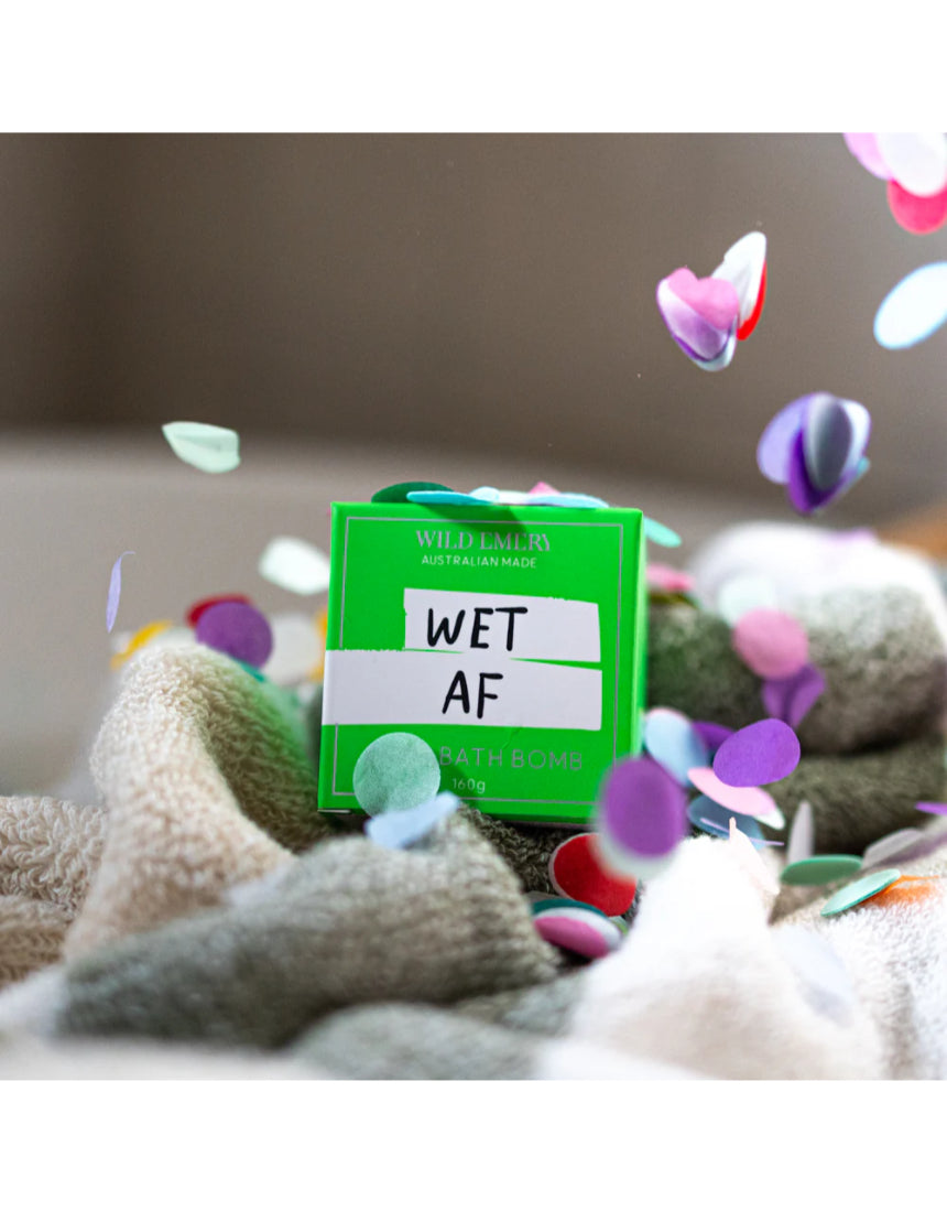 Wild Emery Wet AF Bath Bomb in vibrant colors, showing a round, fizzing bath bomb with a bold, playful design for bath & body use.