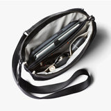 Bellroy Tokyo Side Bag in Raven, a sleek black crossbody bag with adjustable strap and compact design for everyday use.