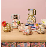 Jones & Co Samira Vase filled with colorful flowers, showcasing a stylish decorative vase on a neutral background.