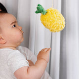 Living Textiles stroller toys featuring plush pineapple and cherries, colorful and soft for baby entertainment.