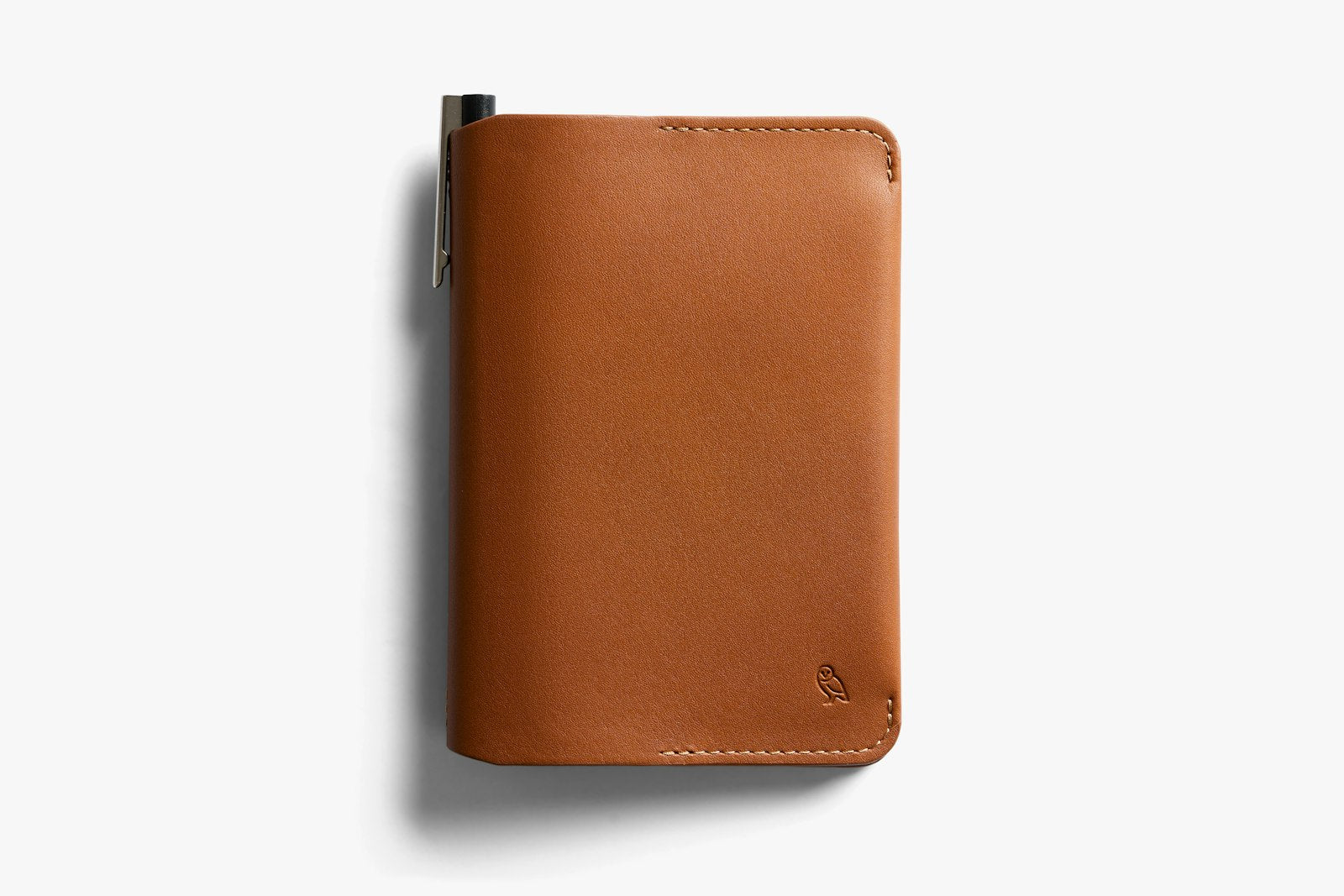 Bellroy caramel notebook cover with sleek leather design, featuring a slim, compact silhouette and visible stitching.