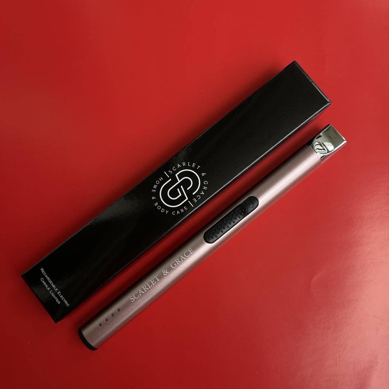 Scarlet & Grace rechargeable matte black lighter with sleek design and electronic ignition, displayed on a neutral background.