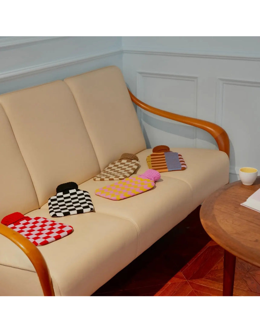 Casa Rolio hot water bottle with candy-colored cover, soft fabric and cozy design for warmth and comfort.