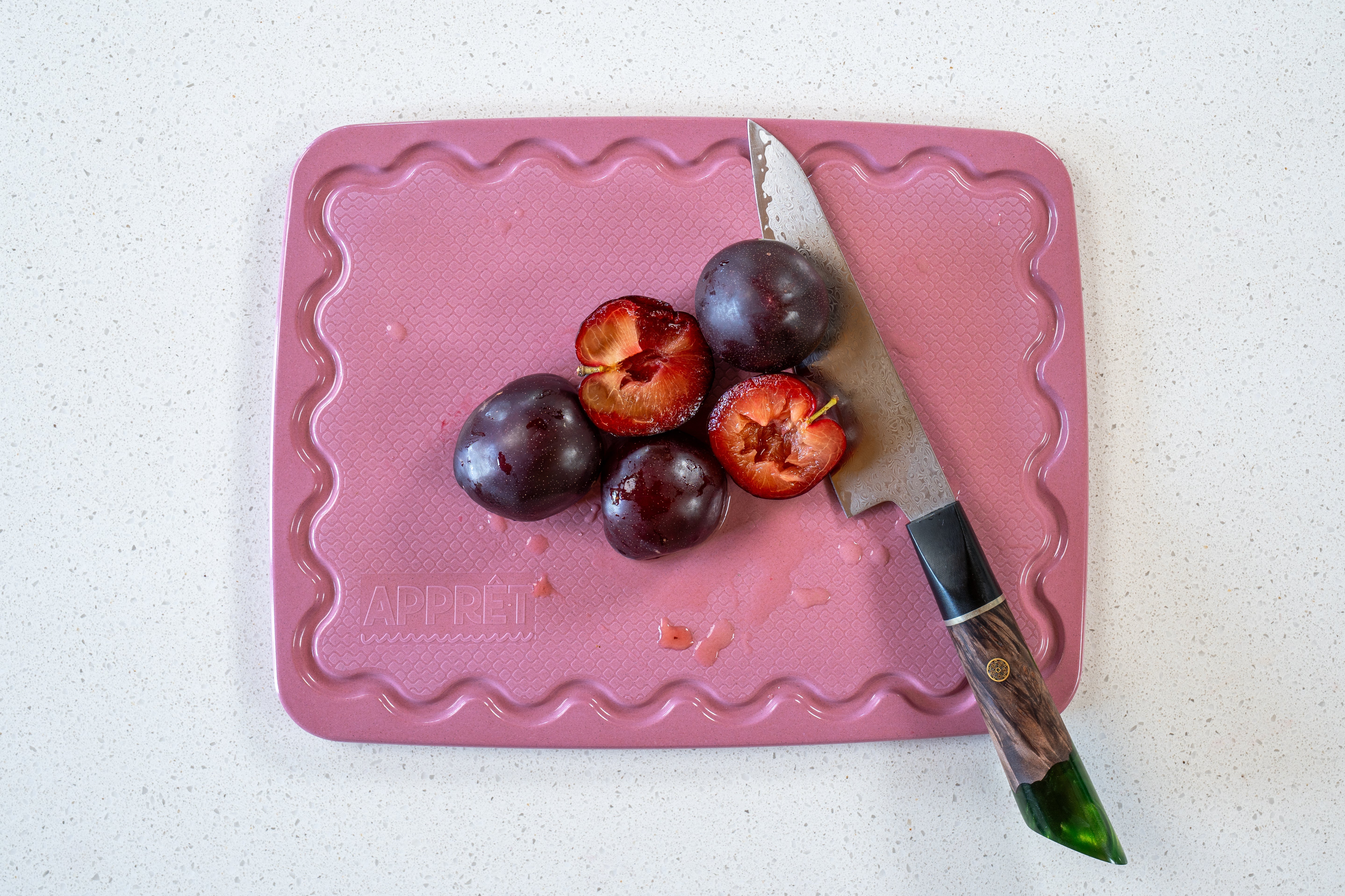 Maison Apprêt pink petite chopping board with smooth surface and compact size, ideal for food prep and serving.