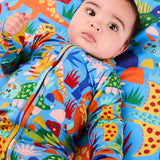 Kip & Co Dinosaur Roar organic baby long sleeve zip romper with colorful dinosaur print and soft cotton fabric.