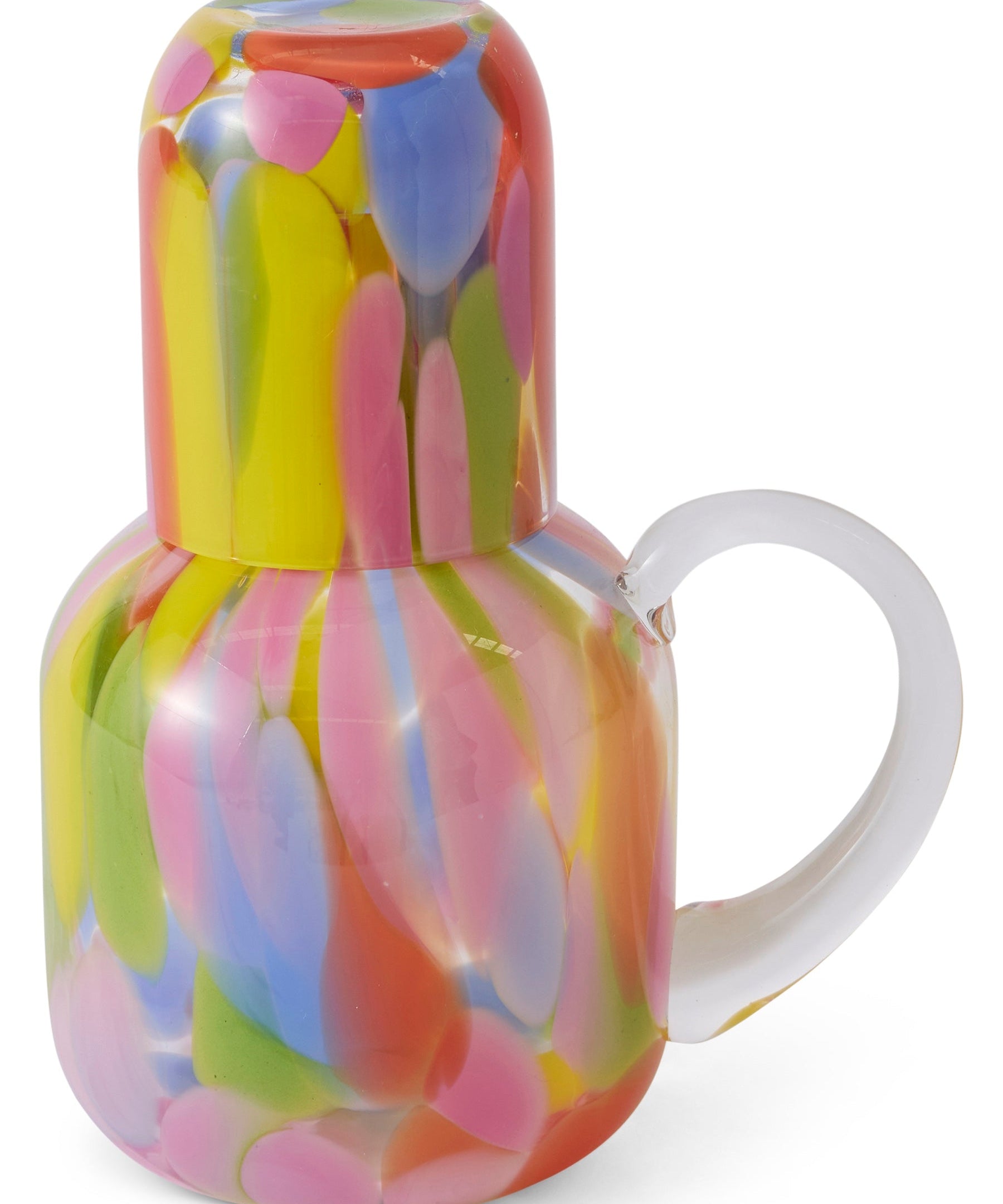 Kip & Co Festiva glass and carafe set with colorful floral patterns, clear glass design, and elegant shapes for serving beverages.
