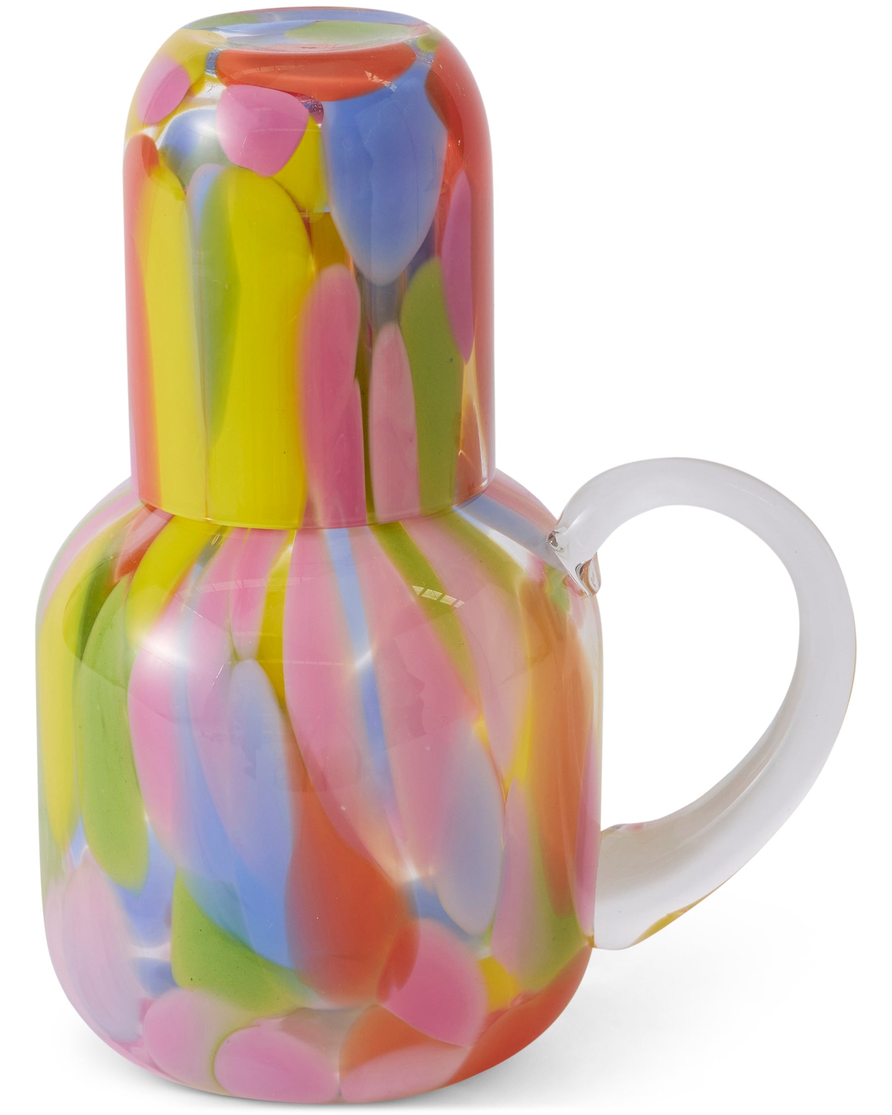 Kip & Co Festiva glass and carafe set with colorful floral patterns, clear glass design, and elegant shapes for serving beverages.