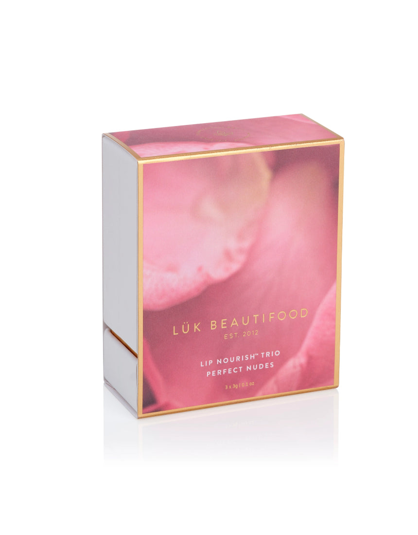 Lük Beautifood Lip Nourish Trio with three nude lip balms in natural shades, displayed in a compact, eco-friendly packaging.