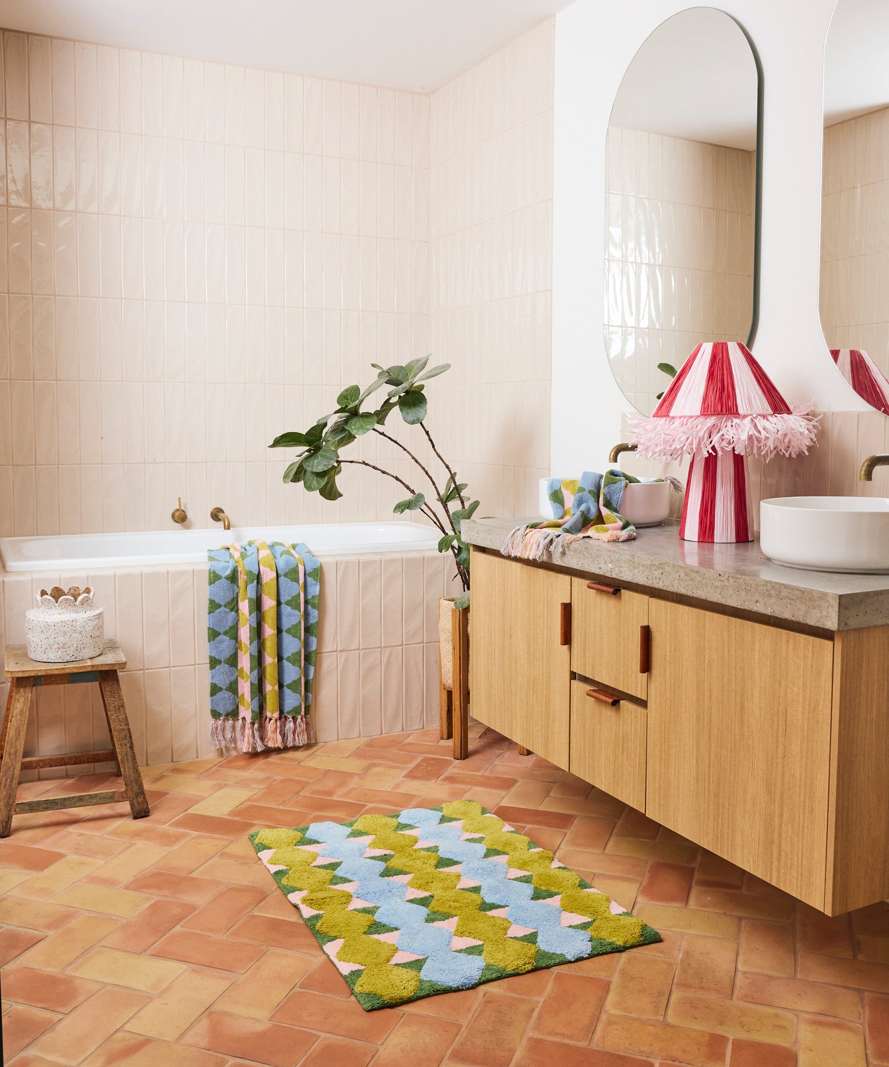 Kip & Co Genie bath mat with colorful, plush design featuring vibrant patterns, soft texture, and non-slip backing.