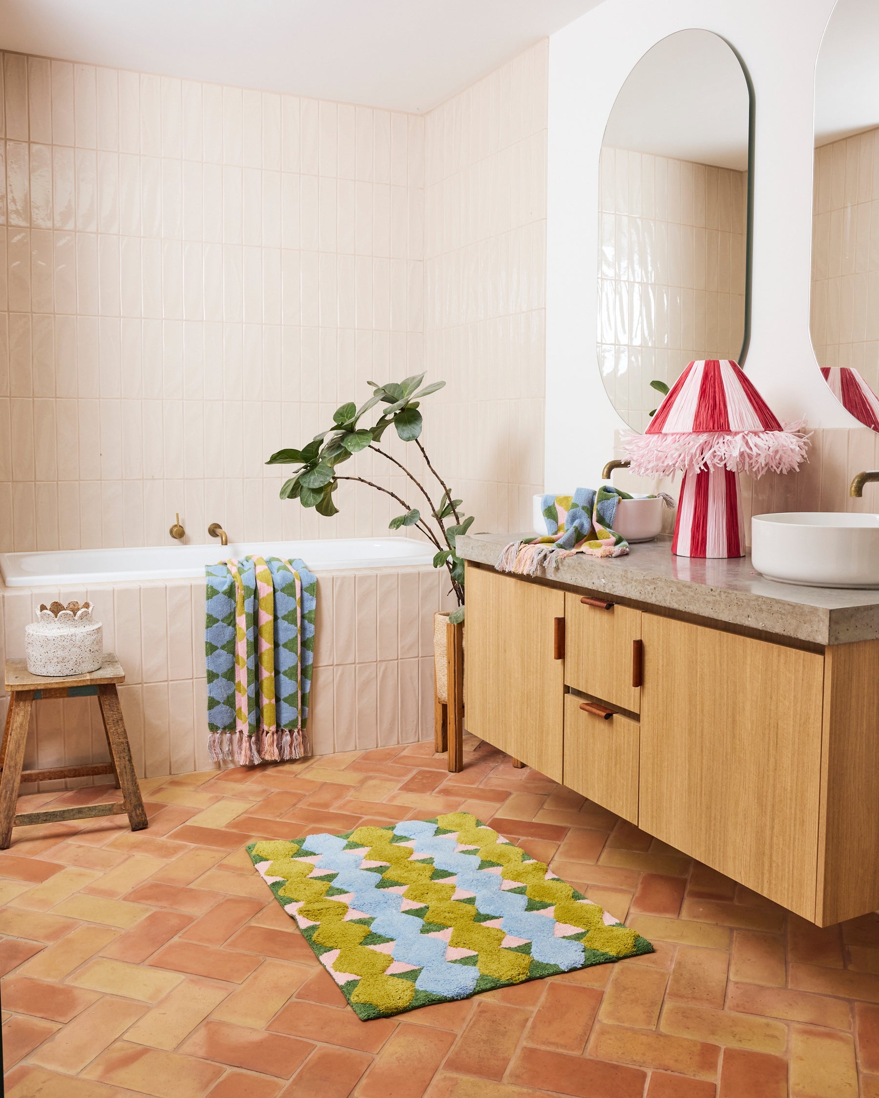 Kip & Co Genie bath mat with colorful, plush design featuring vibrant patterns, soft texture, and non-slip backing.