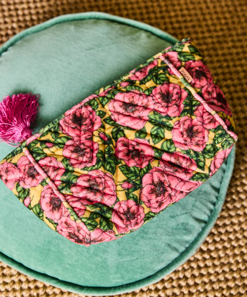 Kip & Co Golden Peony velvet toiletry bag with floral pattern, soft velvet fabric, and zipper closure for accessories storage.