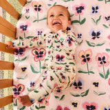 Kip & Co Pretty Pansy organic long sleeve zip romper for babies, featuring floral pattern and soft fabric.