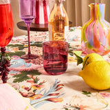 Kip & Co lilac fiesta glass and carafe set with colorful patterns, designed for serving beverages in a stylish, vibrant way.