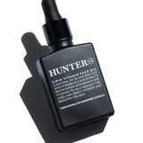 Hunter Lab Lipid Vitamin Face Oil 30ml in a clear glass bottle, designed for nourishing face and skin care.