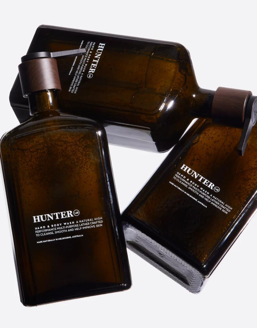 Hunter Lab Forever Kit for bath and body, featuring skincare products in sleek bottles and jars, designed for healthy skin.