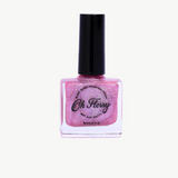 Kids nail polish by Oh Flossy featuring vibrant, colorful bottles perfect for fun, safe nail art for children.