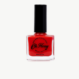 Bright pink kids nail polish by Oh Flossy with a playful bottle design, perfect for young children’s nail art.