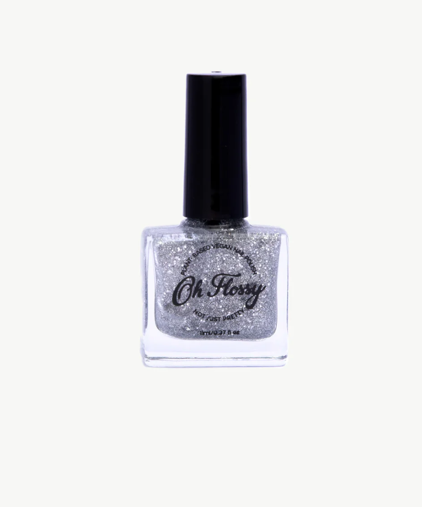 Kids' Oh Flossy nail polish bottle with colorful label and clear glass showcasing bright pink nail color.