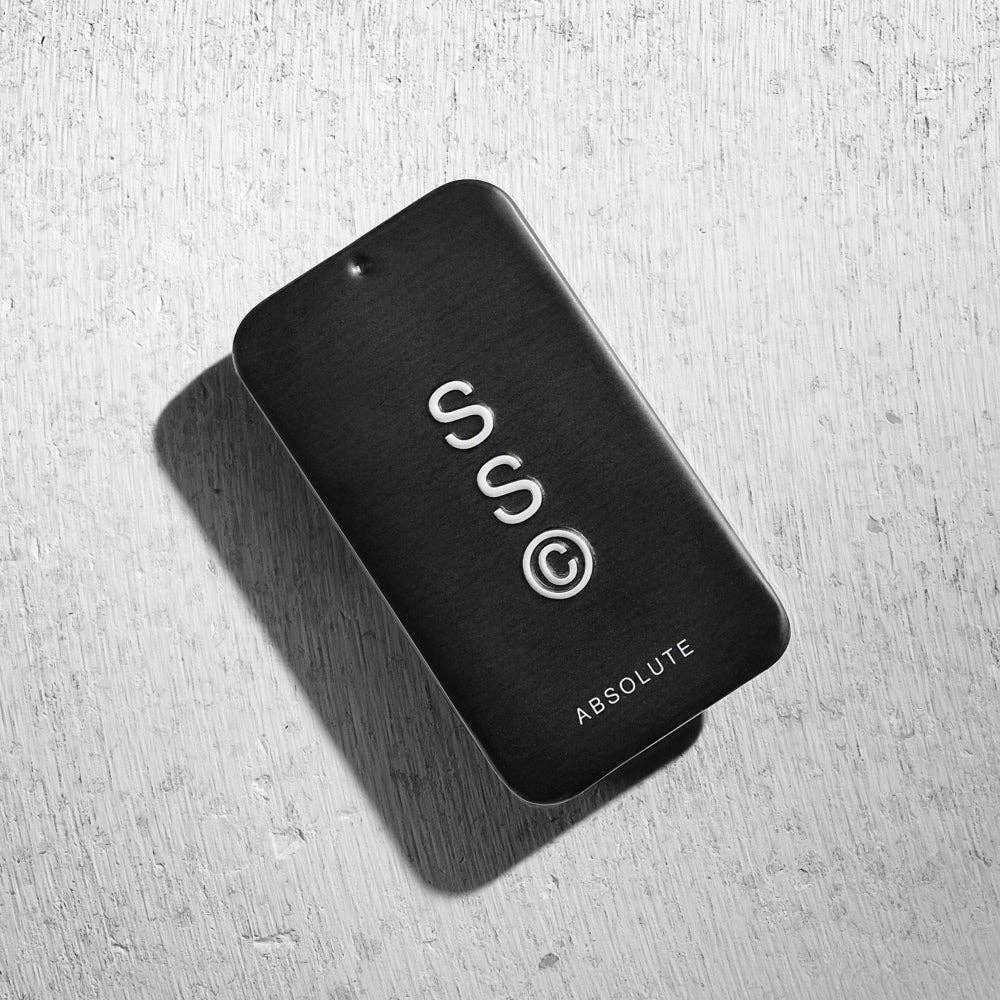 Solid State Absolute Solid Cologne jar with black lid, showcasing the sleek, minimalist design of the solid fragrance product.