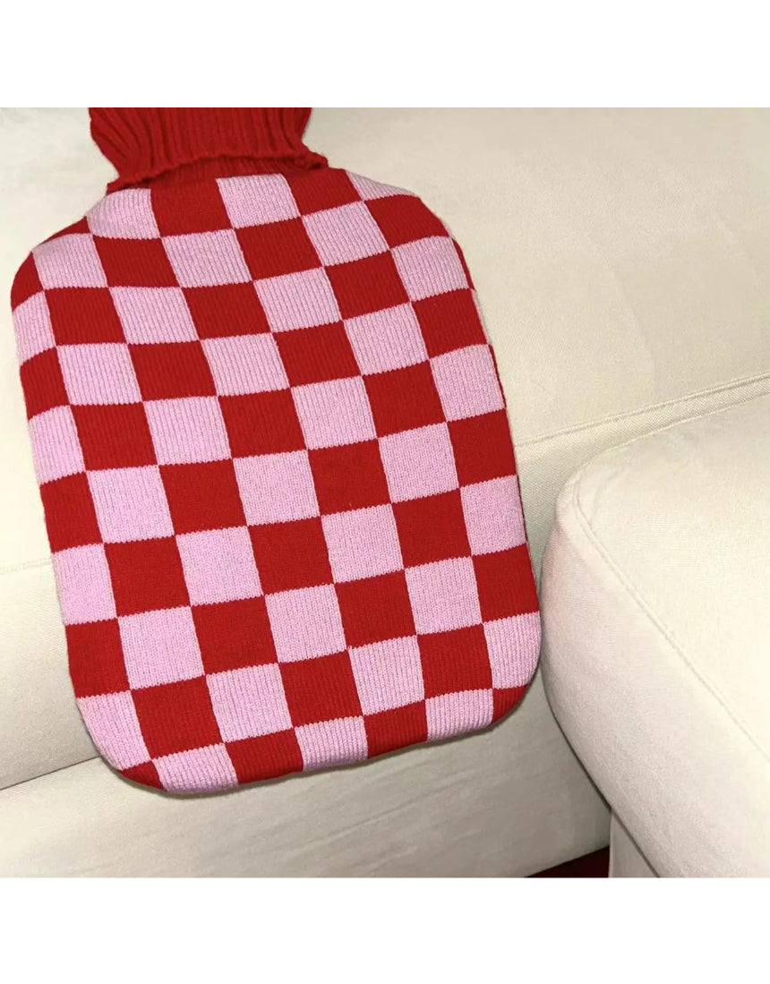 Casa Rolio hot water bottle with blush cover, soft fabric exterior and cozy design for warmth and comfort.