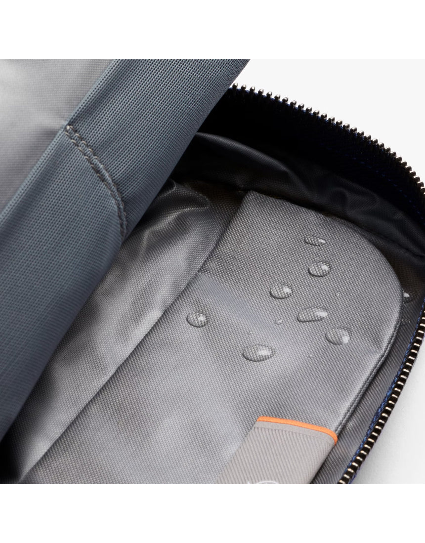 Bellroy toiletry kit in navy with zipper closure, compact design, and multiple compartments for travel hygiene essentials.