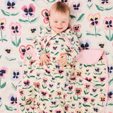Kip & Co Pretty Pansy organic cotton baby blanket with floral pattern, soft and cozy for infants.