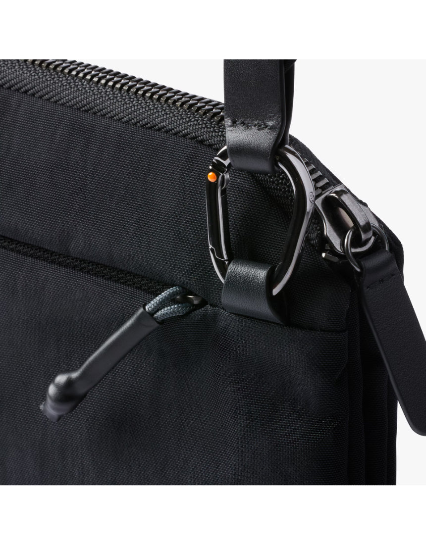 Bellroy Tokyo Side Bag in Raven, a sleek black crossbody bag with adjustable strap and minimalist design, showing front view.
