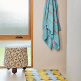 Kip & Co Genie bath mat featuring a colorful, plush design perfect for adding comfort and style to your bathroom.