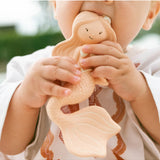 Winnie Parkes Maeve the Mermaid rubber teether in peach, soft and textured for soothing babies' gums.